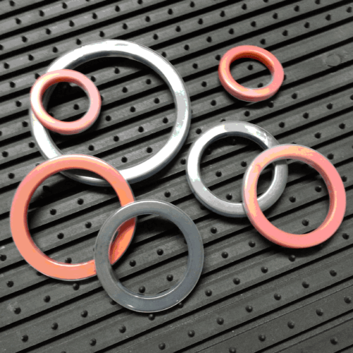 Teflon encapsulated cam and groove gasket for cam lock couplings